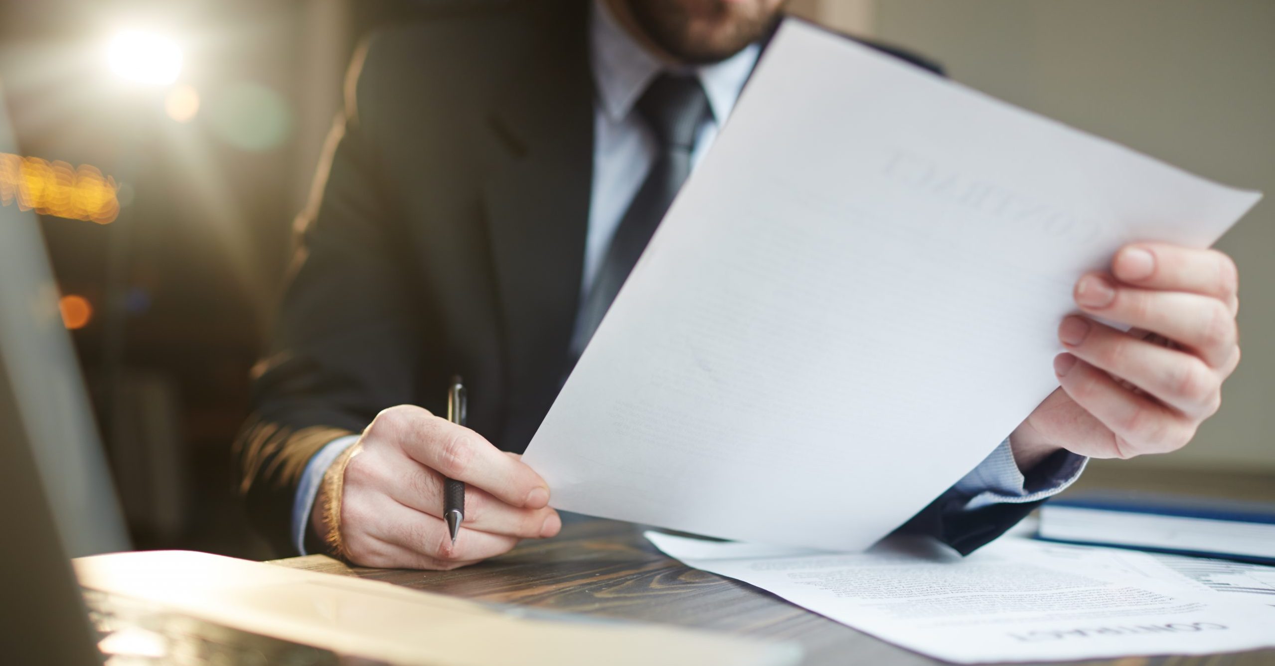 Businessman Working with Documentation at Desk
